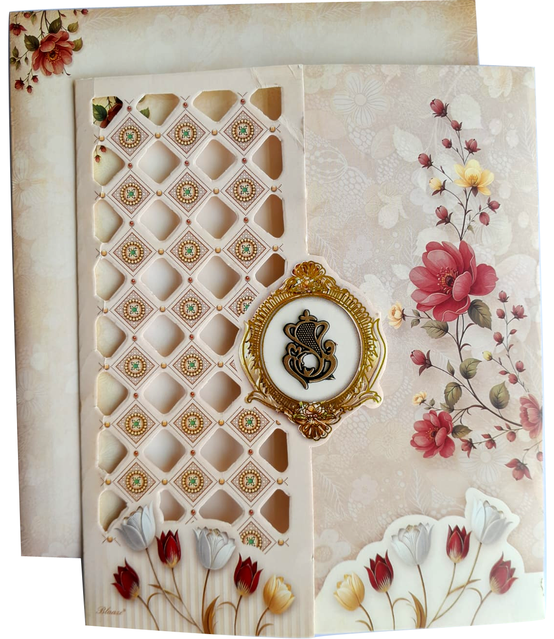 A laser-cut or die-cut geometric pattern floral artwork with tulips and roses. — wedding invitation card